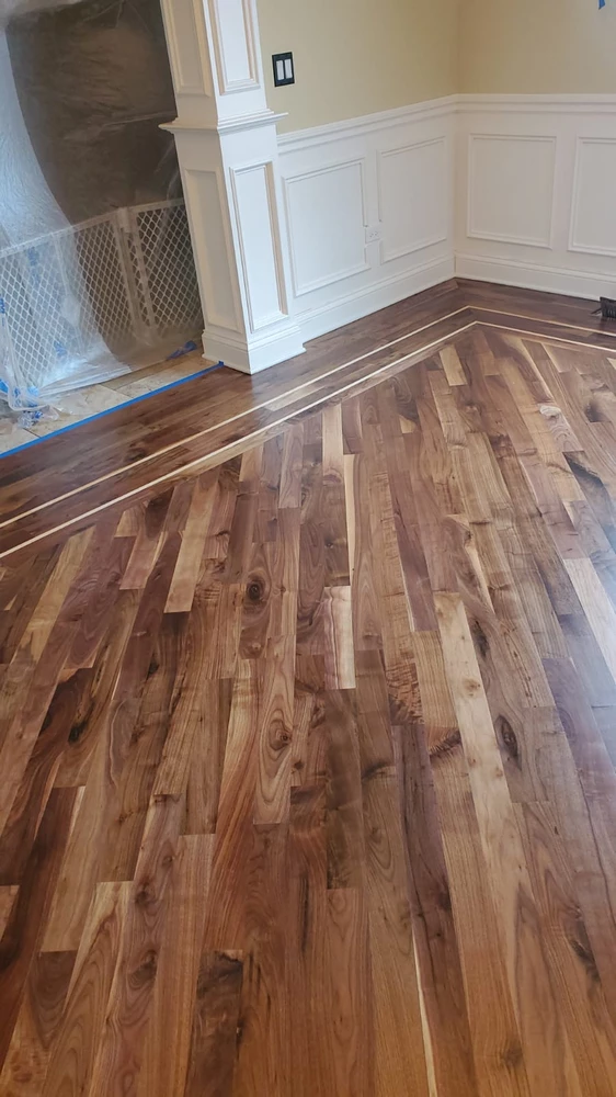 Clean modern room with hardwood floor refinishing